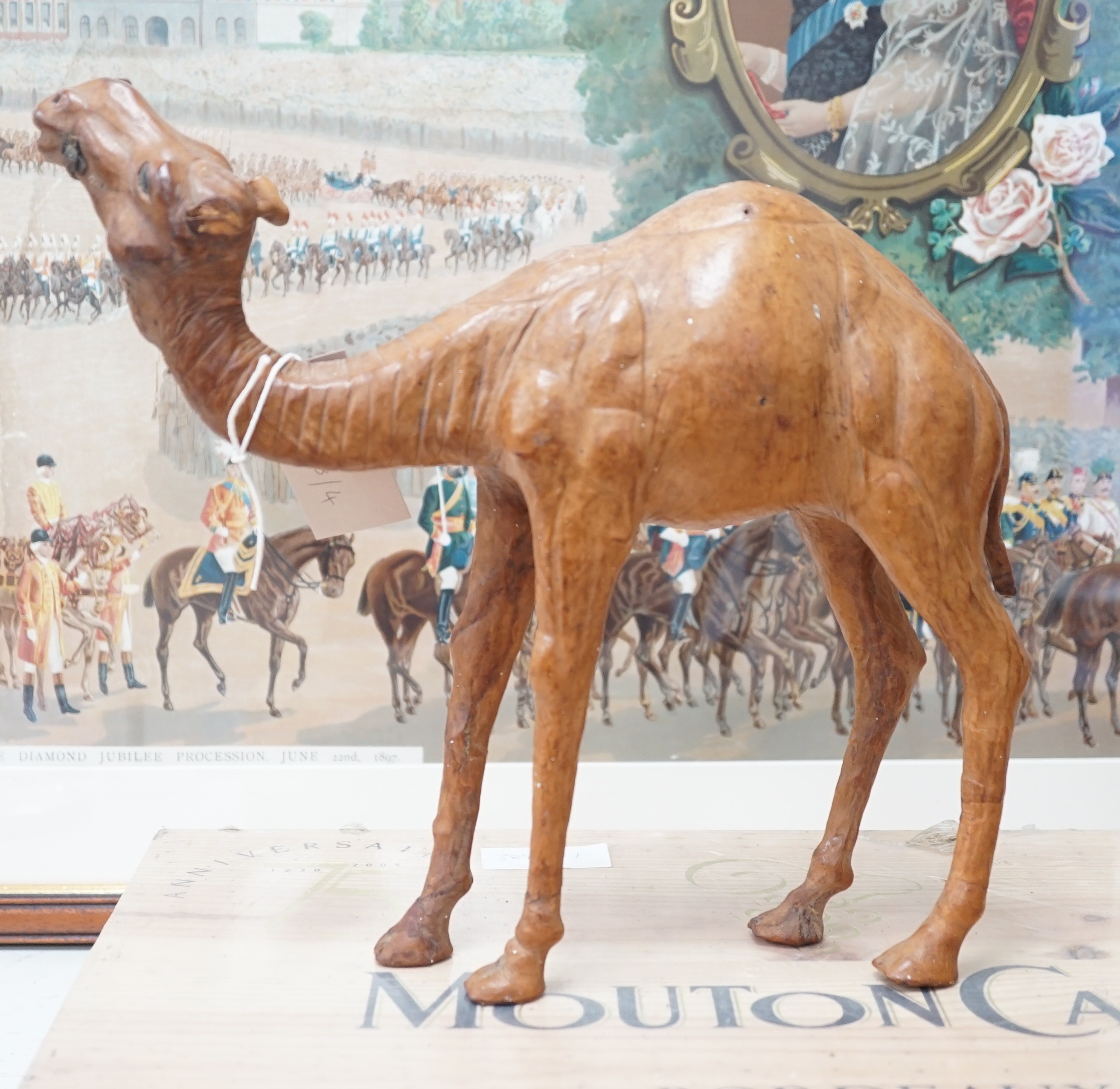 A leather covered model of a camel 32cm long